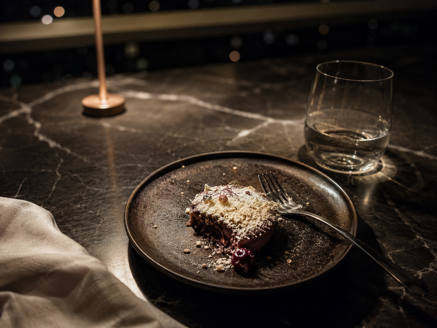 A restrained dessert table in low evening light.