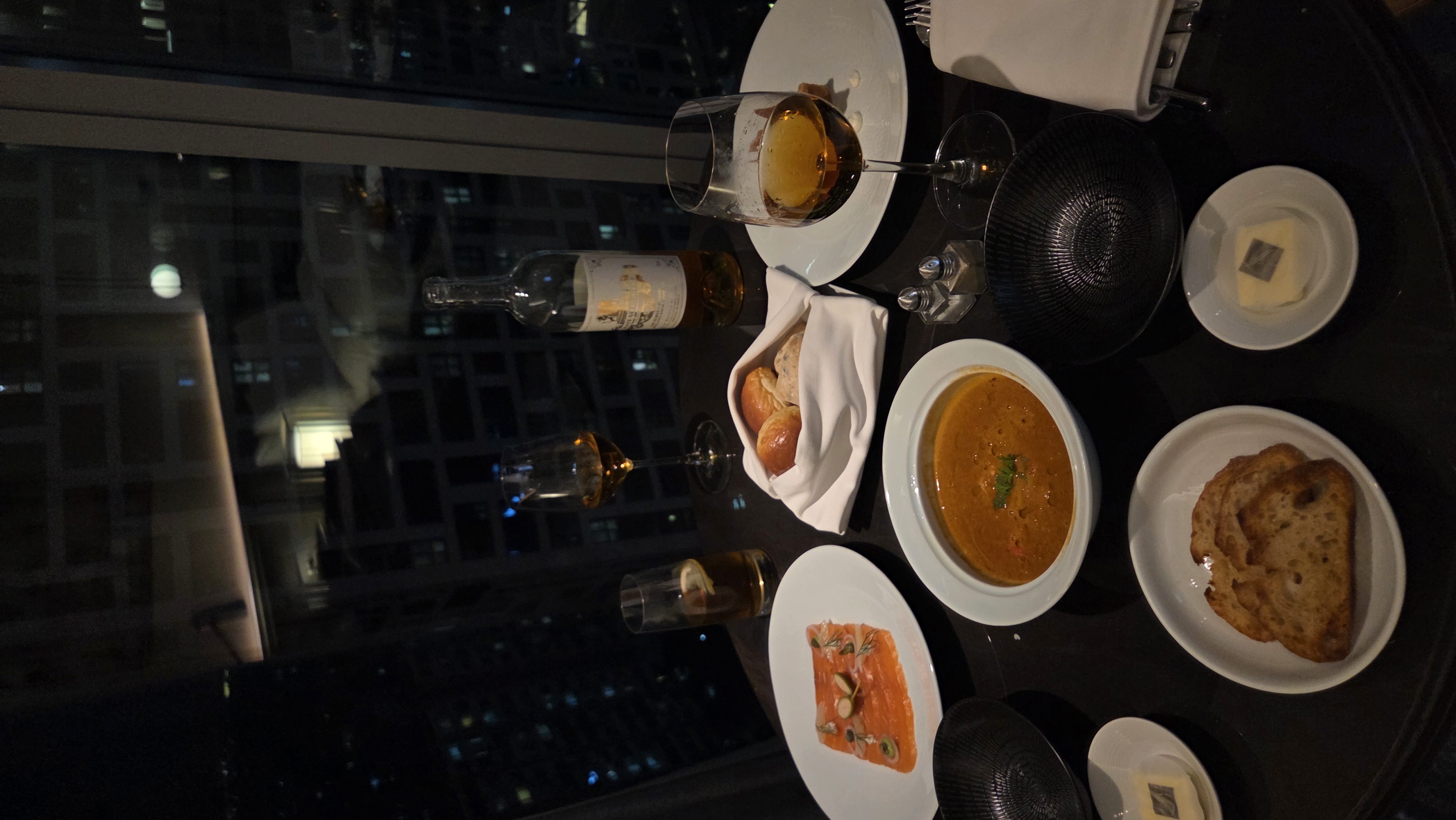 A quiet restaurant table by a window in Seoul, photographed in natural light.